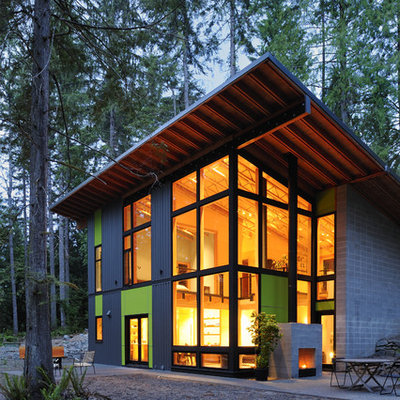 Inspiration for a large contemporary multicolored two-story mixed siding exterior home remodel in Seattle with a shed roof