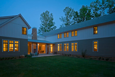Inspiration for a large transitional green two-story concrete fiberboard exterior home remodel in Atlanta