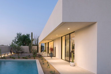 Mid-sized modern white one-story stucco exterior home idea in Phoenix