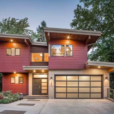 Inspiration for a contemporary red two-story exterior home remodel in San Francisco with a shed roof