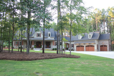 Large arts and crafts beige two-story wood gable roof photo in Atlanta