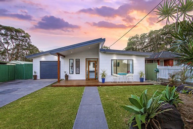 Design ideas for a large and white modern bungalow house exterior in Central Coast.