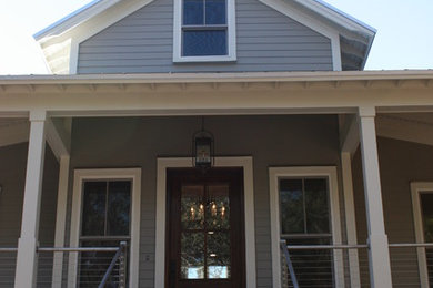 Example of a mid-sized classic gray three-story wood gable roof design in Atlanta