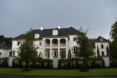 Inspiration for a timeless white house exterior remodel in Houston