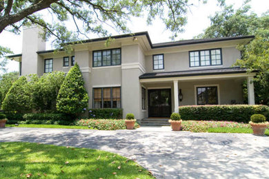 Inspiration for a timeless beige two-story exterior home remodel in Houston