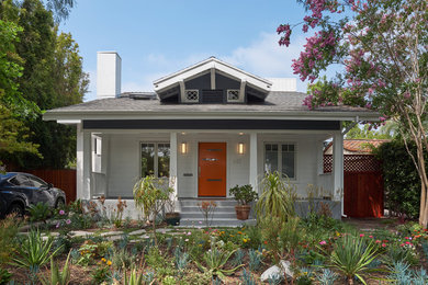 Mid-sized arts and crafts blue two-story wood exterior home photo in Los Angeles with a shingle roof