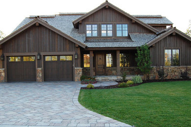 Inspiration for a mid-sized rustic brown two-story mixed siding exterior home remodel in Other with a shingle roof