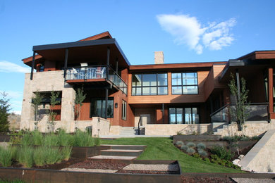 Large trendy brown two-story mixed siding house exterior photo in Salt Lake City with a shed roof