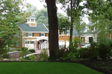 Inspiration for a large modern multicolored two-story wood exterior home remodel in Cleveland with a shingle roof