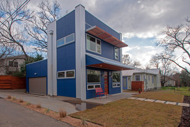Mid-sized modern blue two-story mixed siding flat roof idea in Austin