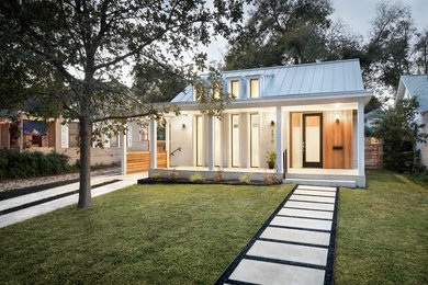 Small modern white one-story mixed siding exterior home idea in Austin with a metal roof