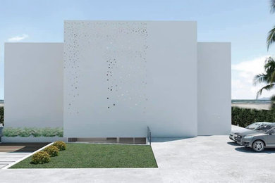 Modelo de fachada minimalista de tres plantas