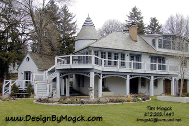 Design ideas for an expansive and white bohemian two floor house exterior in Minneapolis.