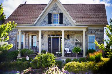 Example of a mid-sized classic multicolored one-story brick exterior home design in Toronto with a shingle roof