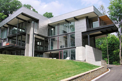Large trendy gray three-story metal exterior home photo in Cincinnati