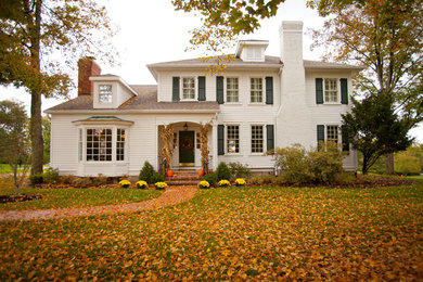 Inspiration for a country white two-story exterior home remodel in Cincinnati