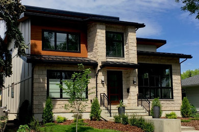 Inspiration for a contemporary stone exterior home remodel in Edmonton