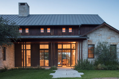 Transitional mixed siding exterior home photo in Austin with a metal roof