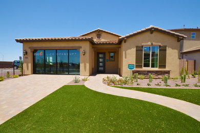 Mid-sized tuscan beige one-story stone exterior home photo in Phoenix
