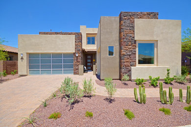 Mid-sized contemporary beige two-story stone exterior home idea in Phoenix