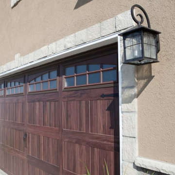 Insulated Designer Garage Doors & Stone Siding