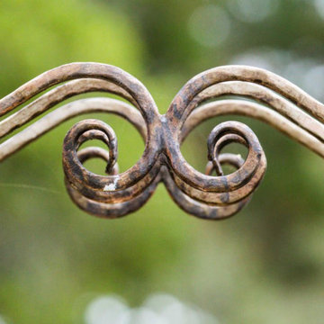 Iron canopy support (curlicues)