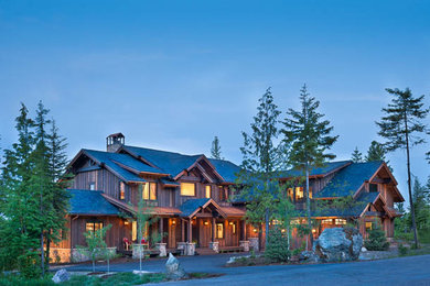 Large rustic brown two-story wood gable roof idea in Other