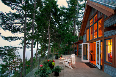 Rustic bungalow house exterior in Vancouver with wood cladding.