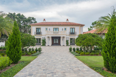 Example of a large classic three-story house exterior design in Orlando