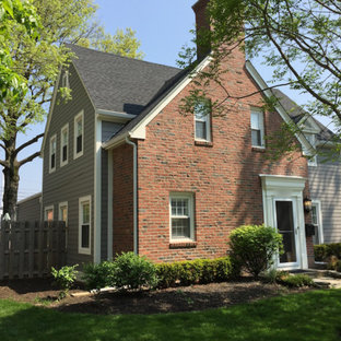 Large elegant gray two-story concrete fiberboard exterior home photo in Columbus
