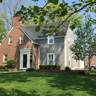 Mid-sized elegant gray two-story concrete fiberboard exterior home photo in Columbus