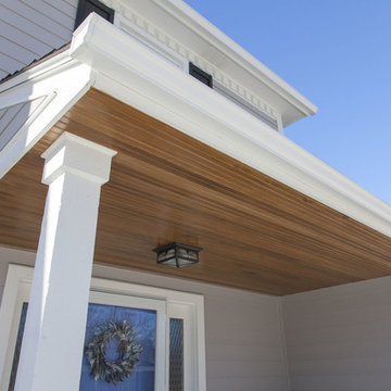 James Hardie Pearl Gray siding installation with wooden porch ceiling