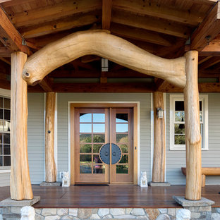 Trendy gray wood gable roof photo in Burlington