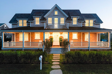 Inspiration for a large coastal two-story wood gable roof remodel in Boston