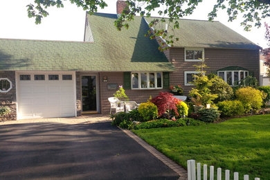 Small brown one-story vinyl exterior home photo in New York