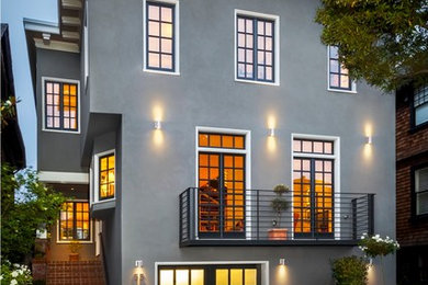 Inspiration for a mid-sized transitional gray three-story stucco exterior home remodel in San Francisco