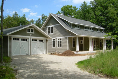 Craftsman gray two-story mixed siding exterior home idea in Other with a shingle roof