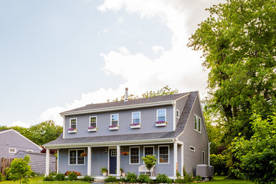 Mid-sized elegant gray two-story concrete fiberboard exterior home photo in Providence with a shingle roof