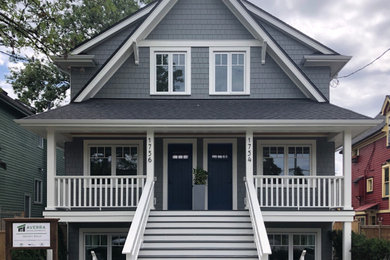 Traditional gray duplex exterior idea in Vancouver with a shingle roof and a black roof