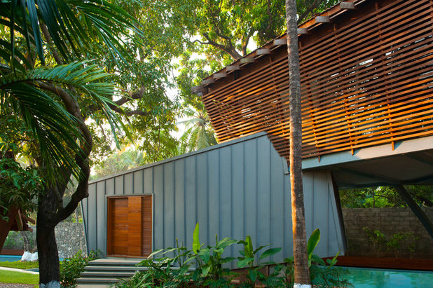 Tropical Exterior by Malik Architecture
