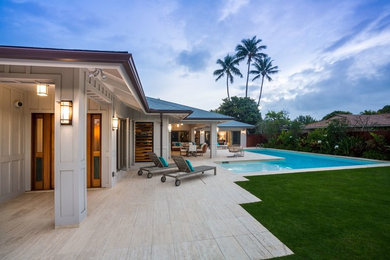 Example of a transitional exterior home design in Hawaii