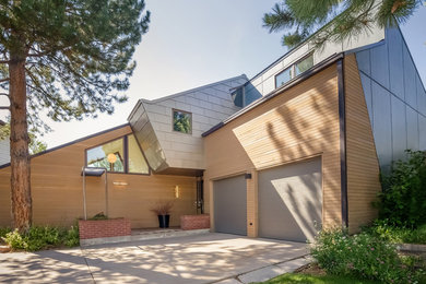 Inspiration for a mid-sized modern blue two-story mixed siding exterior home remodel in Denver