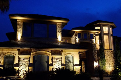 Mid-sized brown two-story stone house exterior idea in Houston
