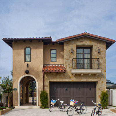 Mediterranean brown two-story exterior home idea in Los Angeles