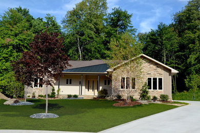 Inspiration for a modern beige exterior home remodel in Cleveland