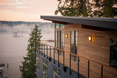Inspiration for a contemporary wood exterior home remodel in Seattle