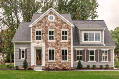 Inspiration for a mid-sized transitional gray two-story mixed siding exterior home remodel in Cleveland with a shingle roof