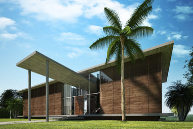 Ejemplo de fachada marrón tropical de tamaño medio de dos plantas con tejado plano y revestimiento de hormigón