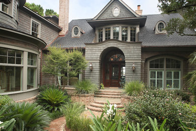 Large traditional gray two-story wood exterior home idea in Charleston with a shingle roof