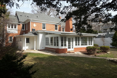 Example of a transitional exterior home design in Milwaukee